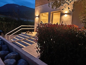 A staircase leading to a building with a dog resting on the steps. - le lenze (Pozzilli)