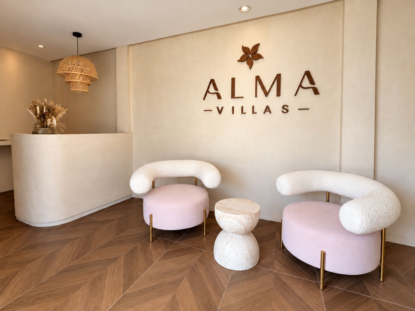 A reception area with a modern design, featuring a reception desk and two uniquely shaped chairs with round ottomans.