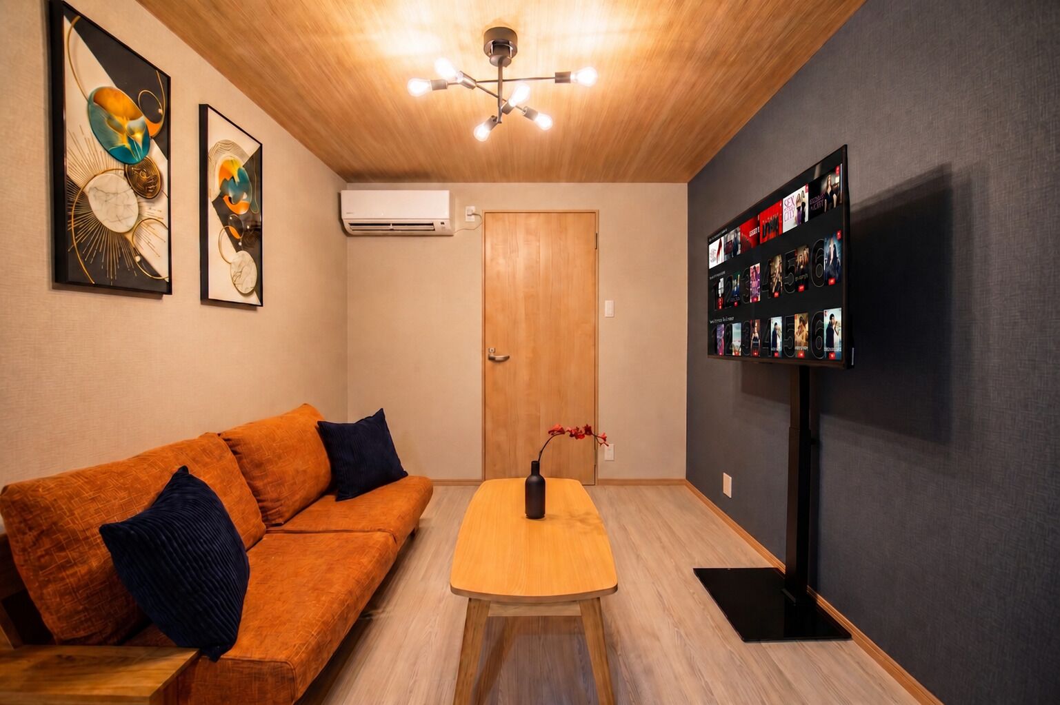 Comfort House | Living area | 50-inch flat-screen TV with cable channels