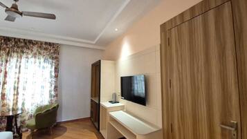 Deluxe Double Room, City View | Living area | 43-inch Smart TV with digital channels
