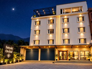 A multi-story hotel with a sign reading 'Satyaki Orchid' at the entrance. - Hotel Satyaki Orchid (Katra)