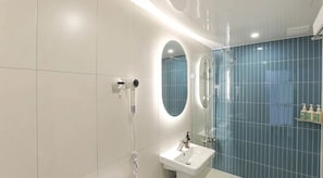 A modern bathroom with a white sink, a mirror, and a shower. - Hotel GEUMO on (Gumi)