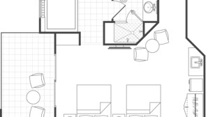 Un plan d’étage comprenant une cuisine, un coin repas, deux chambres, une salle de bain et un salon.