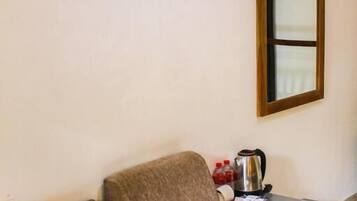 Deluxe Triple Room, Balcony | Living area