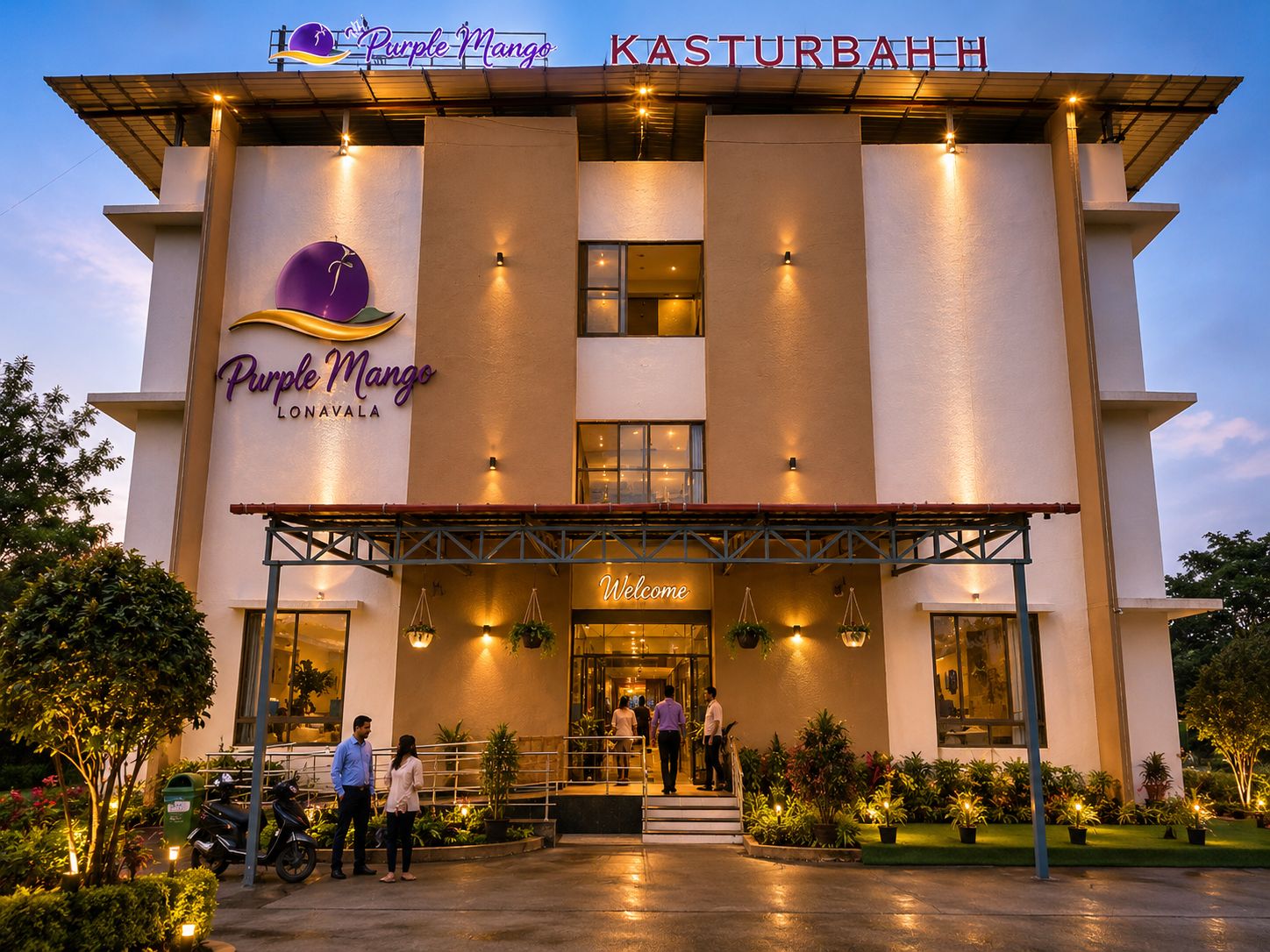 A hotel named Purple Mango with a modern facade, a welcoming entrance, and a signboard above the entrance.
