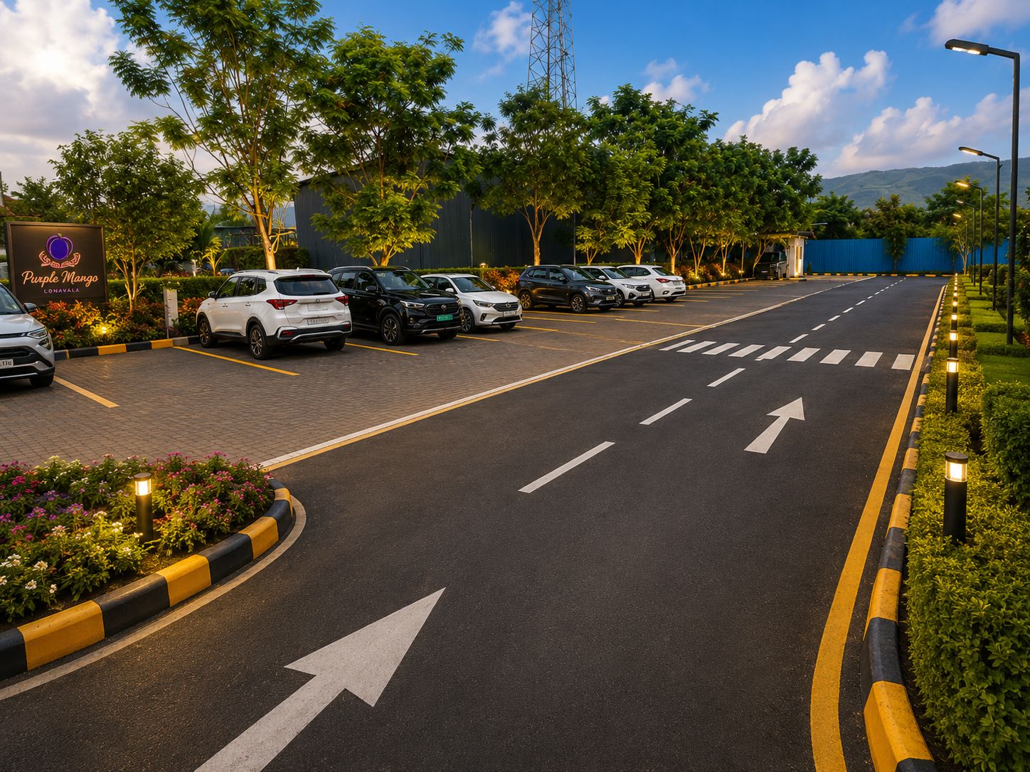 A parking lot with multiple cars, directional arrows on the road, and a sign for 'Purple Mango Lonavala'.