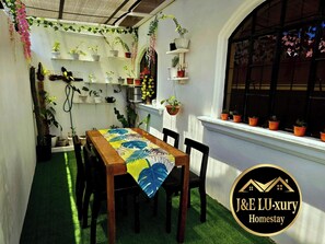 Outdoor dining - Cozy 3-BR house. 15 pax.  Fast WIFI. Near Iloilo airport.  Pet friendly (Zarraga)