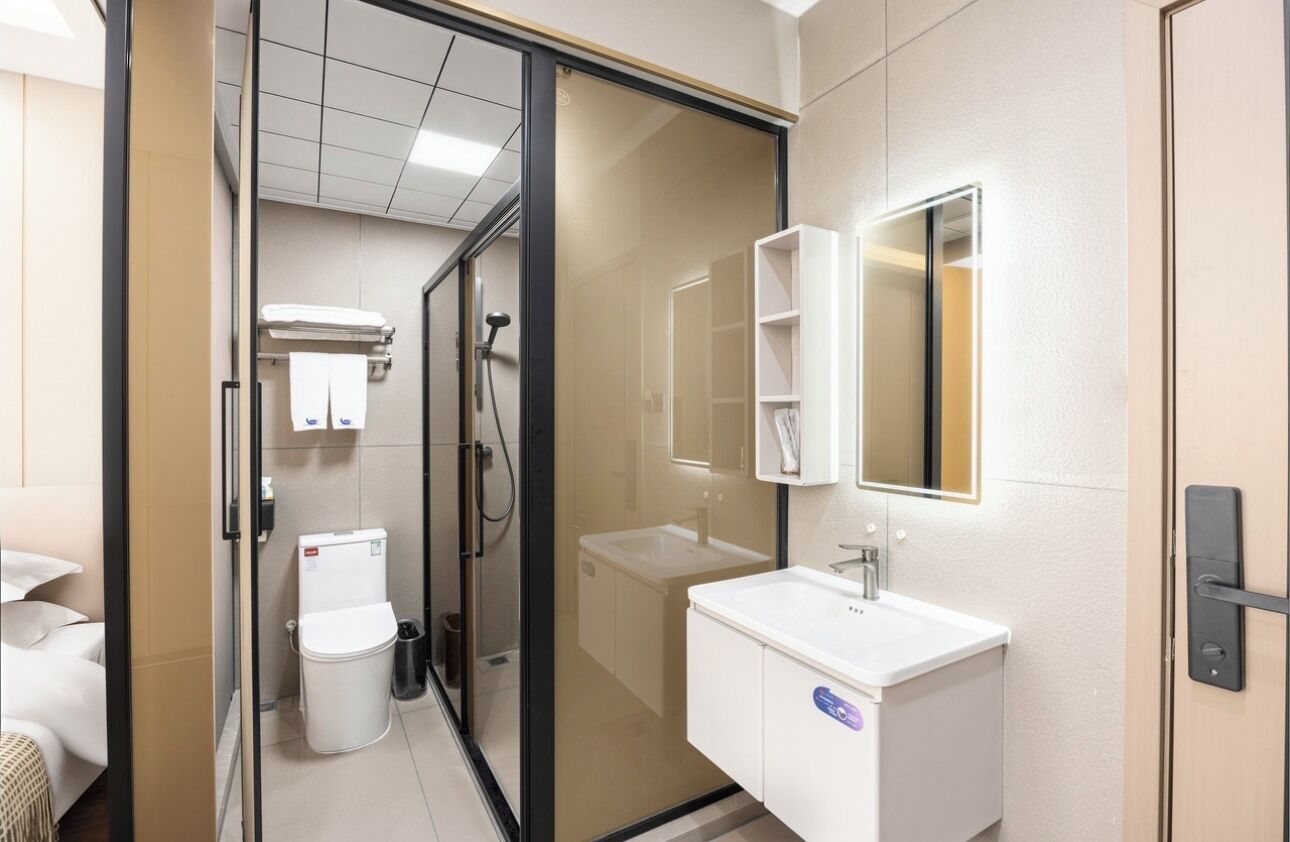 Shower, hair dryer, slippers, towels