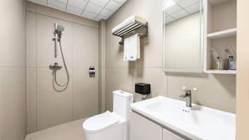 Shower, hair dryer, slippers, towels