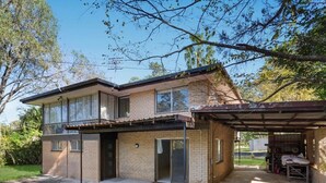 A two-story house with a covered garage, a front porch, and a well-maintained lawn. - Riverview Retreat 3 BDR house 2 toilets (Riverview)