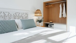 A modern bedroom with a bed, a wardrobe, and a bedside table. - Two-bedroom apartment (Picaña)