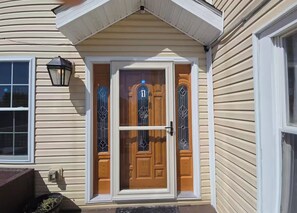 A house with a front door, a mailbox, and a window. - Elberon Escape-4BR Stay Near Bay,10 Min to Casinos (Atlantic City)
