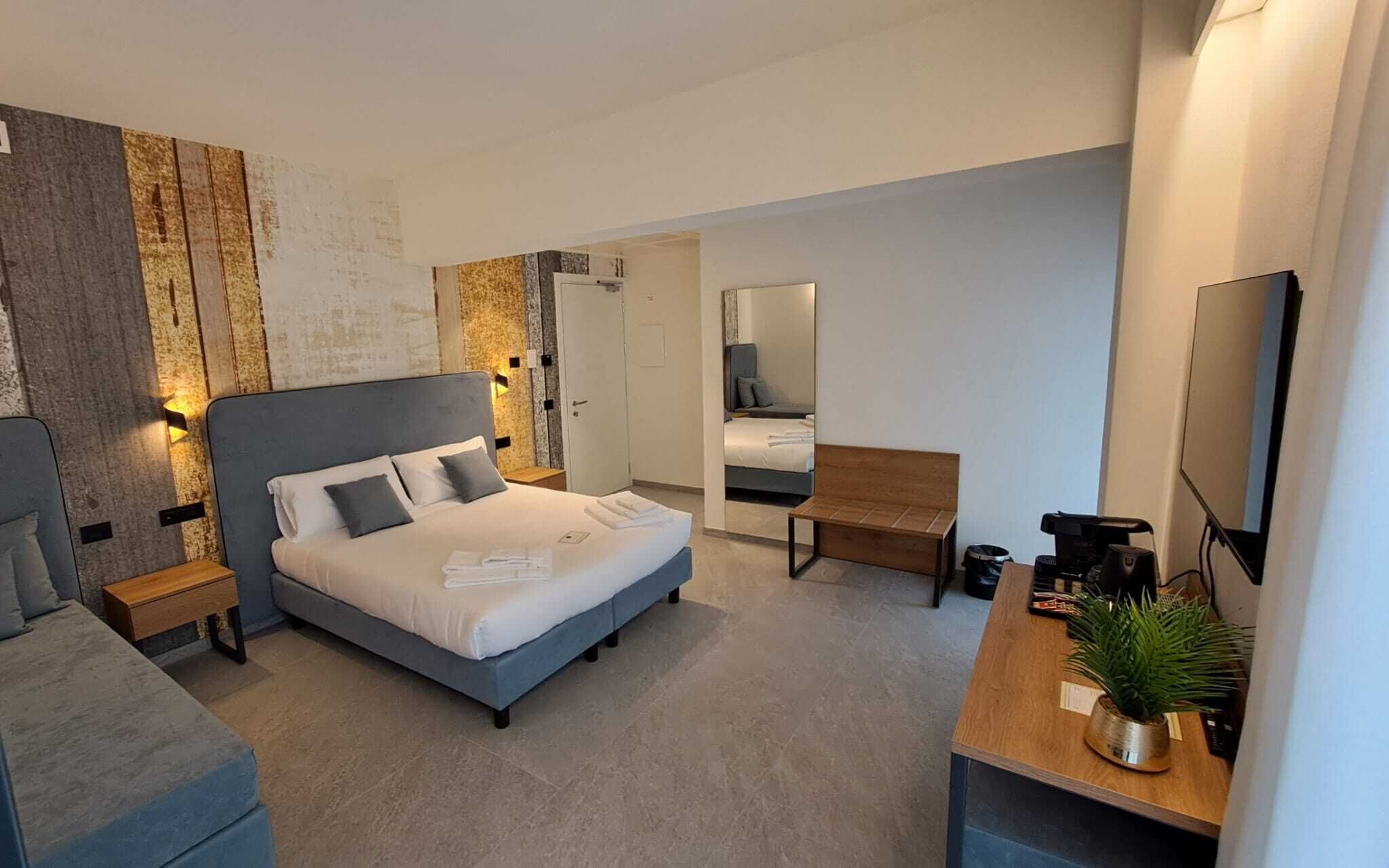 Chambre Triple Deluxe, vue ville | Literie de qualité supérieure, couette en duvet d'oie