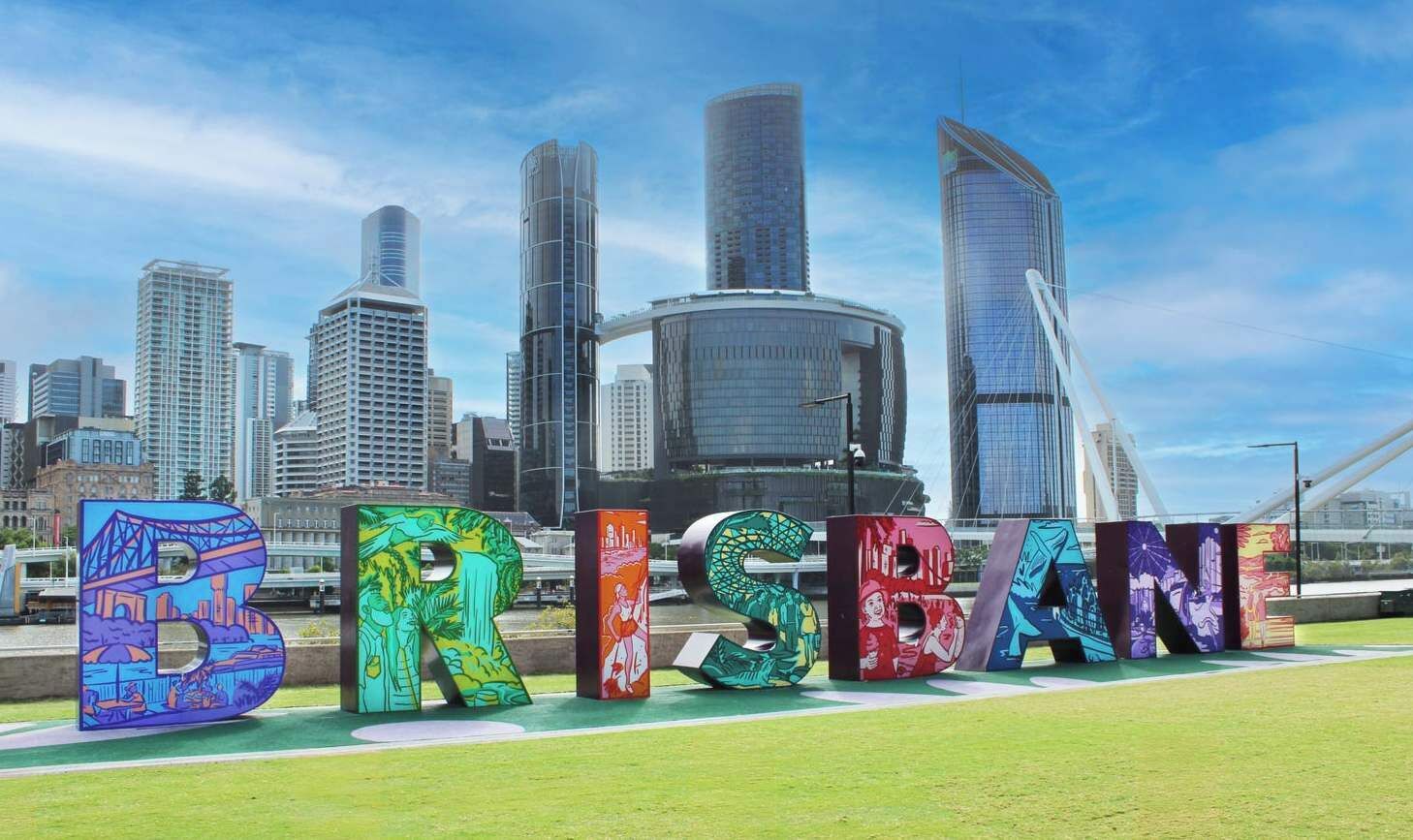 A cityscape with the word 'BRISBANE' spelled out in colorful letters.