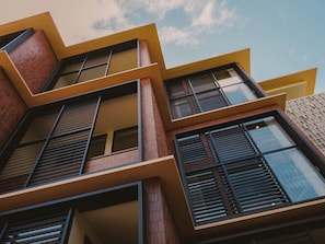 A modern building with multiple balconies and large windows. - Anandaya Sanur  (Sanur Kauh)
