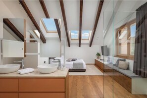 A modern bedroom with skylights, a large window, a bed, a TV, and a glass partition. - Villa Sound of Silence (Danilo Gornje)