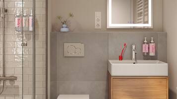 Douche, douche à « effet pluie », articles de toilette gratuits