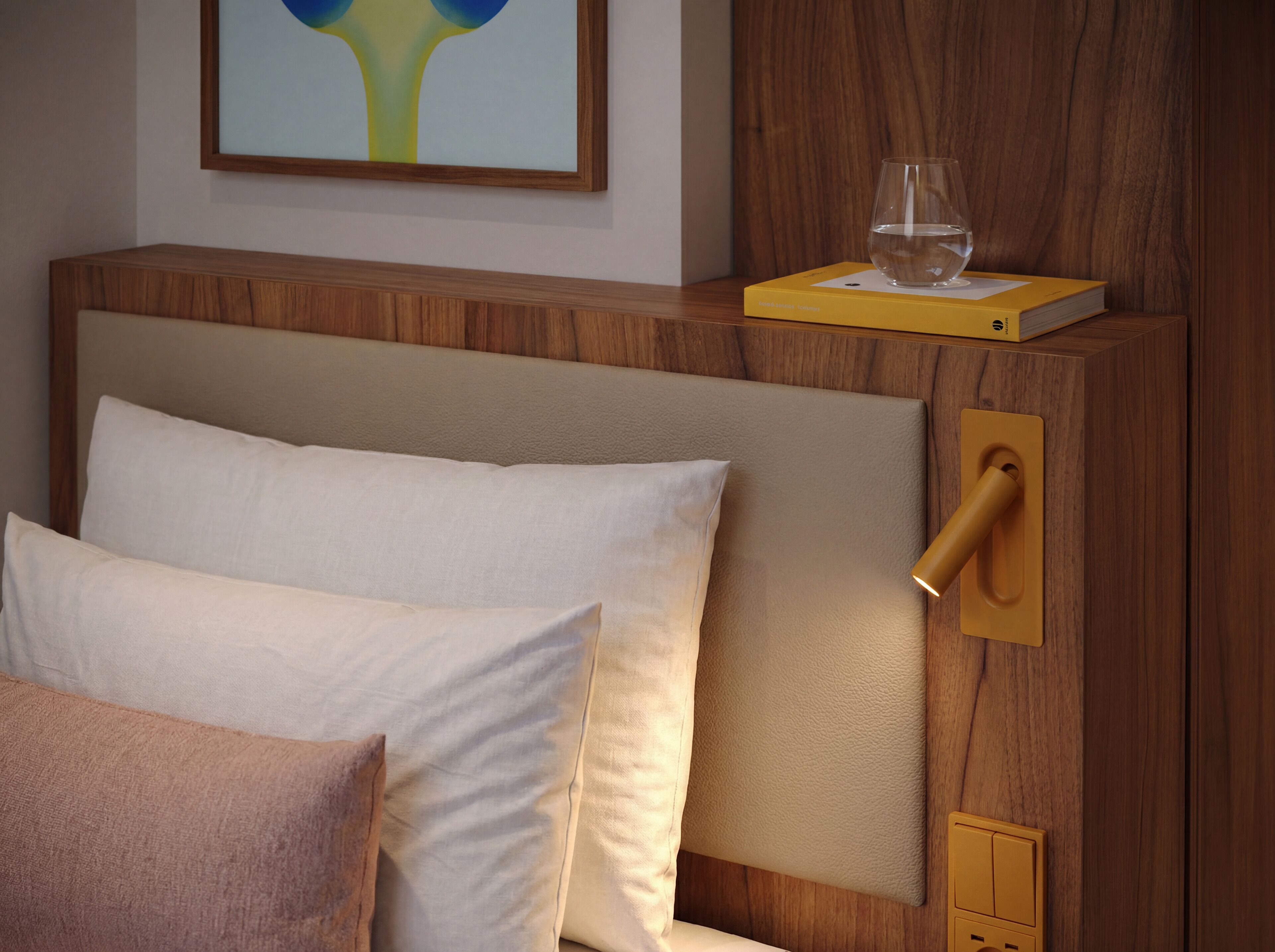 A bedroom with a wooden headboard, a bedside table with a glass and book, and a painting on the wall.