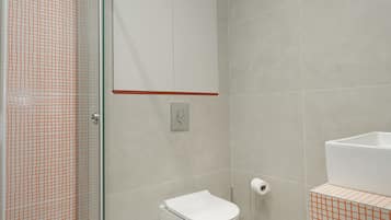 Deluxe Apartment, Balcony, City View | Bathroom | Shower, hair dryer, towels, soap