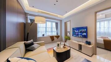 Family Suite, Balcony, Garden View | Desk, laptop workspace, blackout drapes, soundproofing