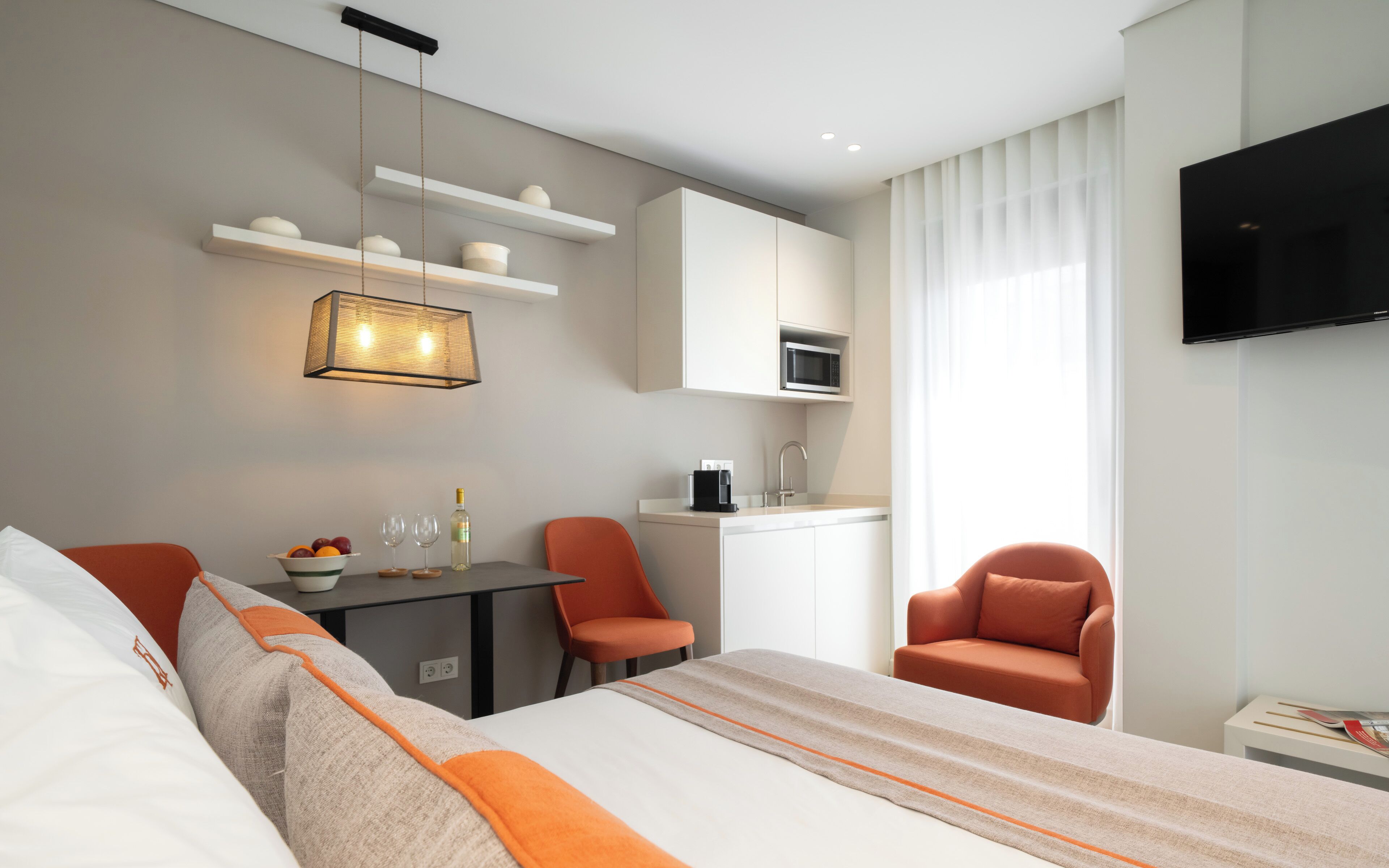 Deluxe Studio Suite, Balcony, City View | In-room safe, desk, laptop workspace, soundproofing