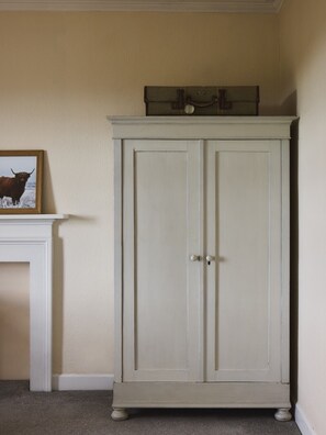 A white cabinet with two doors and a small picture frame on top. - Beautiful 4 bdrm Farmhouse with ocean views, Fife. (Kirkcaldy)