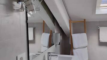 Deluxe Quadruple Room | Bathroom | Slippers