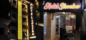 A hotel entrance with a neon sign, a staircase, and a reception desk. - Hotel Sheeba Ajmer (Ajmer)