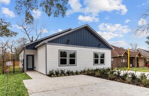 A single-story house with a gabled roof, a front door, and a small front yard with landscaping. - FIFA fam!  3-bedroom townhome in excellent H-Town (Houston)