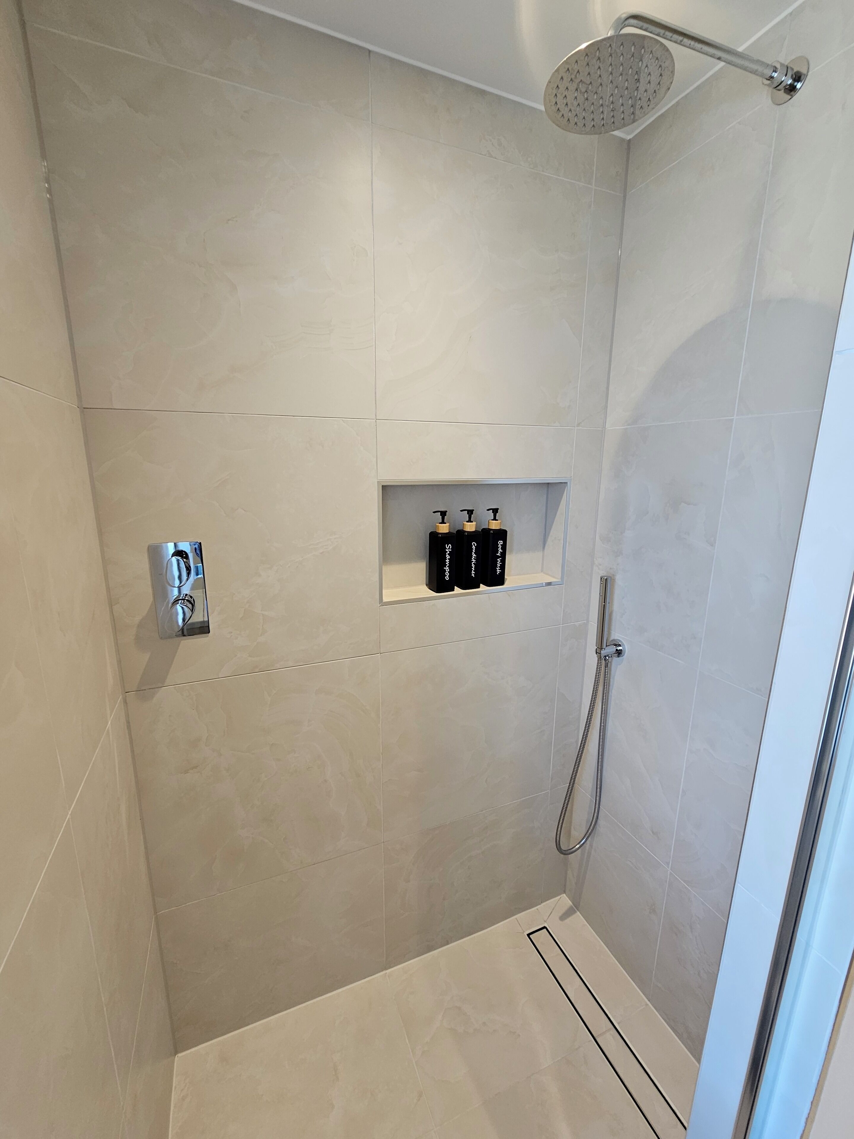 Shower, hair dryer, towels, soap