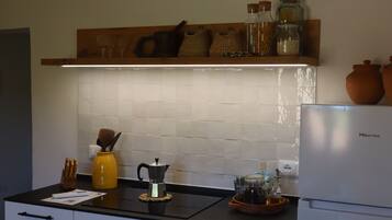 Fridge, microwave, stovetop, coffee/tea maker