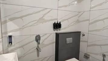Slippers, shampoo, toilet paper
