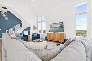 Smart TV, video games, DVD player, books - New 5-bed, 5.5-bath lakefront home with a game lounge and steps to the water. (Port Aransas)
