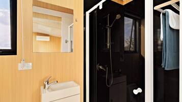 Shower, hair dryer, towels, shampoo