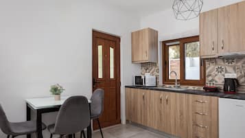 Suite Deluxe | Cocineta privada | Frigobar, microondas, parrilla de estufa y cafetera y tetera