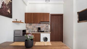 Suite, Balcony | Private kitchenette | Mini-fridge, microwave, stovetop, coffee/tea maker