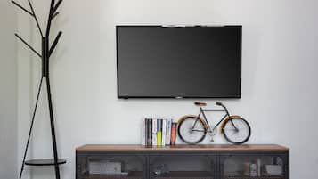 Suite, Balcony | Living area | 30-inch flat-screen TV with cable channels