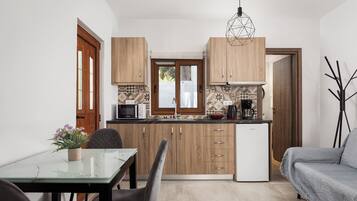 Suite Deluxe | Coin cuisine privé | Mini réfrigérateur, micro-ondes, plaque de cuisson, cafetière/bouilloire
