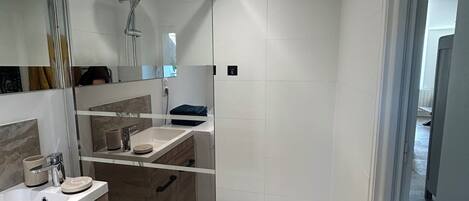 Shower, hair dryer, towels, toilet paper