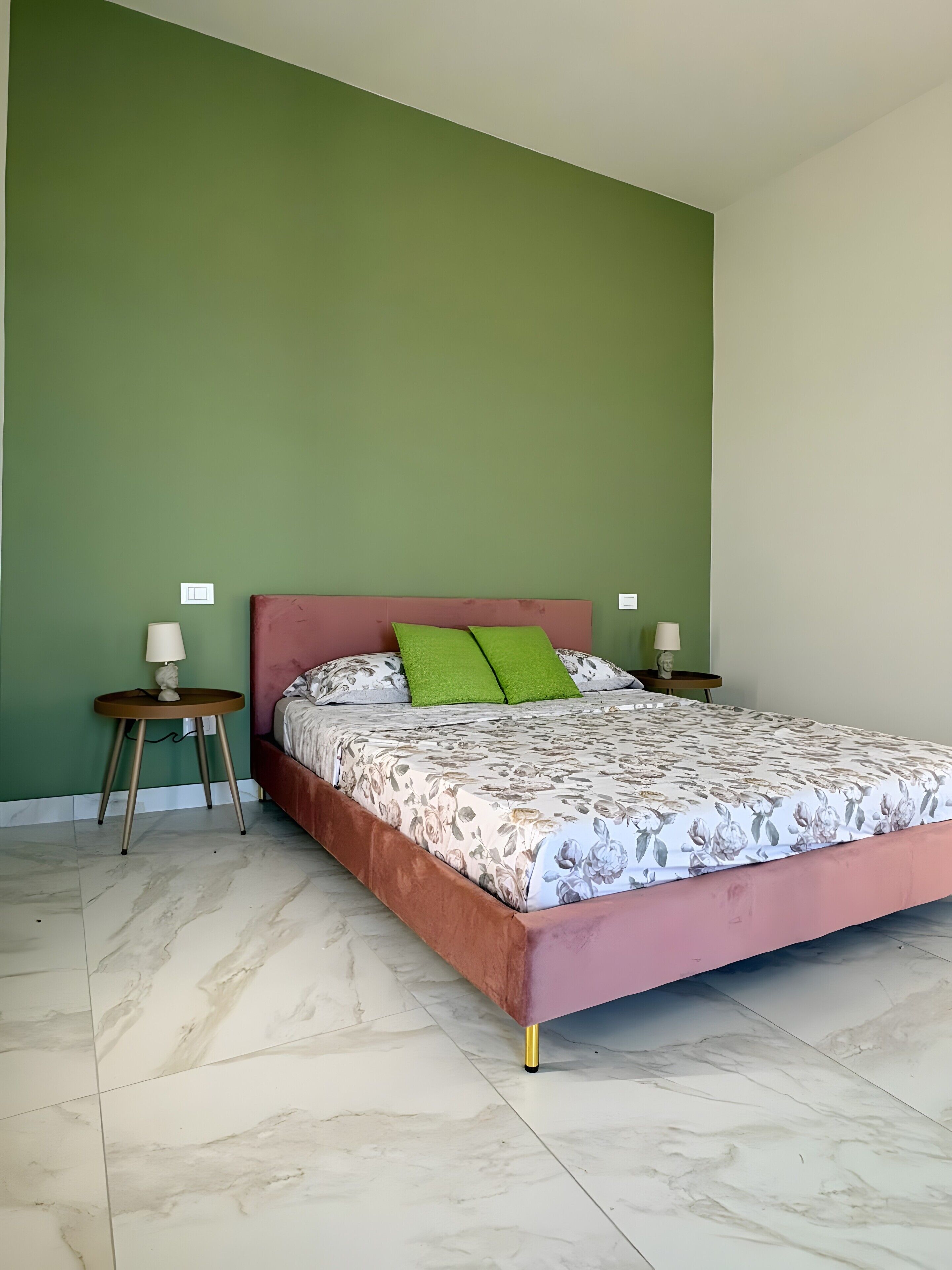 A bedroom with a bed, green walls, and a marble floor.. Room 'Turiddu' at Sikania Agrirelais with Mountain View, Wi-Fi and Air Conditioning