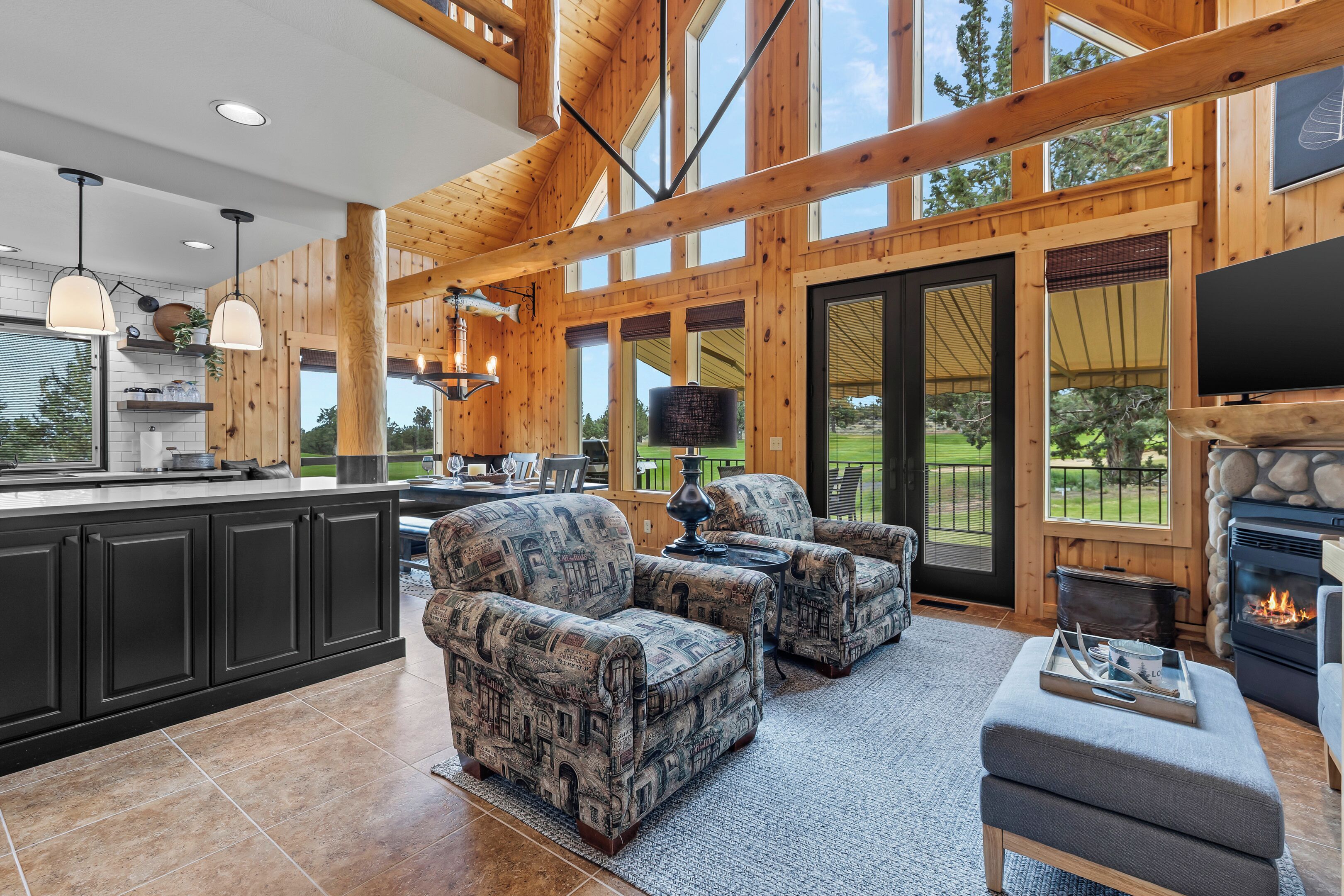 Your spacious retreat blends rustic timber beams and soaring ceilings with cozy seating and a warm fireplace—perfect for unwinding after a day of adventure.