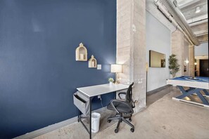A room with a desk, chair, and a pool table. - DT Dallas • Pool Table • Pets • Sleep 10 (Dallas)