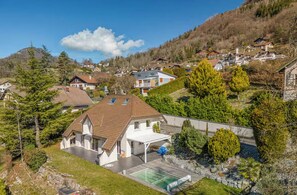 A residential area with houses, a swimming pool, and a hilly backdrop. -
Luxurious Villa Ella Talloires (Talloires-Montmin)