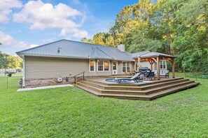 A house with a covered patio, a hot tub, and a deck. - Spillway Oasis- Plunge Pool & Fire Pit (Dothan)