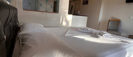Habitació triple, balcó, vistes al jardí | Wifi gratuïta