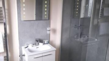 Shower, free toiletries, hair dryer, slippers