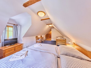 A bedroom with two beds, a television, a desk, and a chair. - Stunning private villa with WIFI, private pool, hot tub, terrace, pets allowed and panoramic view (Jilemnice)
