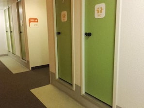 A hallway with doors marked for WC and numbered 209 and 216. - UNISOTEL-MONTAUBAN (Montauban)