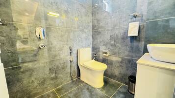 Deluxe Room, Garden View | Bathroom | Shower, hair dryer, slippers, towels