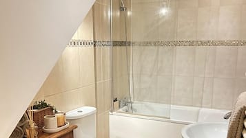 Combined shower/bathtub, deep-soaking bathtub, towels